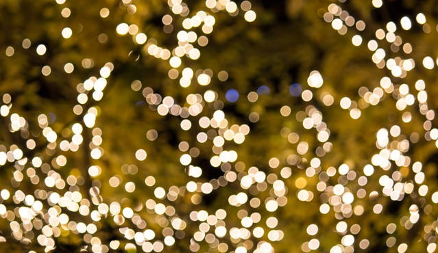 yellow and white twinle lights in a dark background
